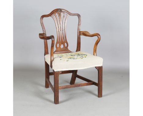A George III Chippendale period mahogany pierced splat back elbow chair with shaped armrests and moulded block legs, height 9