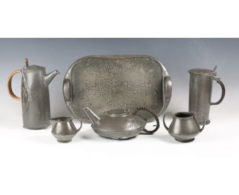 A group of Liberty &amp; Co 'Tudric' pewter, comprising a hot water pot and teapot, model '023', another tappit lidded pot, m