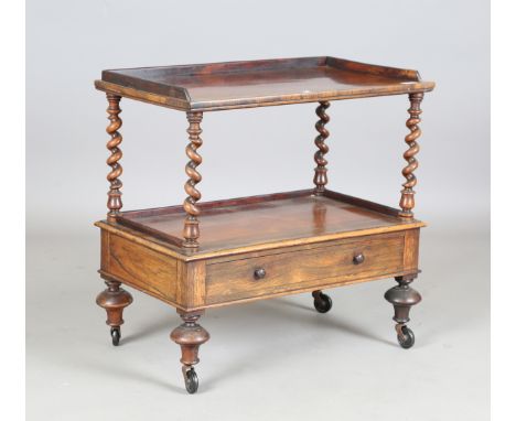 A mid-Victorian rosewood two-tier whatnot by W. &amp; C. Wilkinson of 14 Ludgate Hill, height 67cm, width 69cm, depth 41cm.Bu