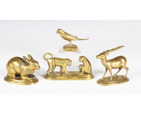 A late 19th century Indian cast and engraved brass model of an antelope, length 7cm, a similar cast model of a parrot, a rabb