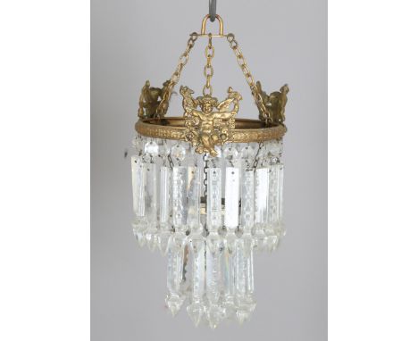 An early/mid-20th century gilt metal and cut glass ceiling light, the two graduated tiers of spear drops supported by a cheru