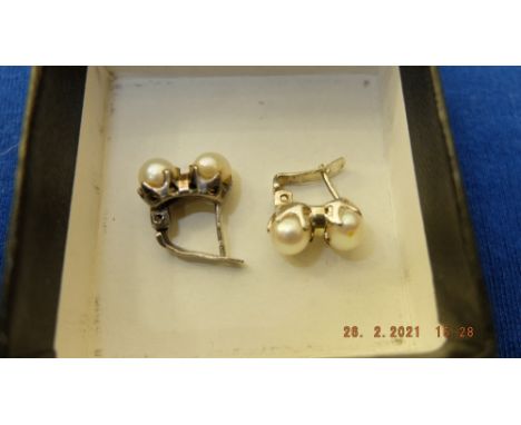 A pair of cultured pearl earrings