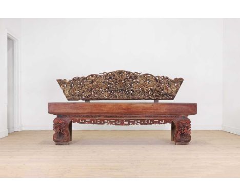 A giltwood carved bench, late 19th/early 20th century, Chinese, the carved and pierced back decorated with dragons, figures a
