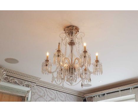 A cut-glass six-light chandelier,20th century, French, with scrolling branches suspending variously shaped cut-glass drops, 8