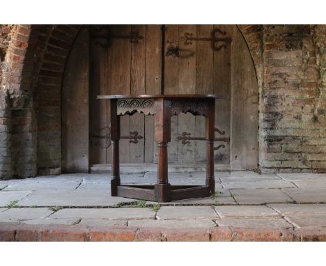 A Charles I-style oak side table, probably 19th century, but incorporating some earlier elements, the demilune top over a can