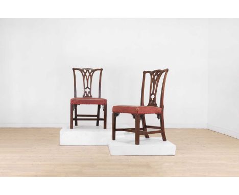 A set of eight George III mahogany dining chairs,late 18th/early 19th century, each in the Gothic Chippendale-style with a pi