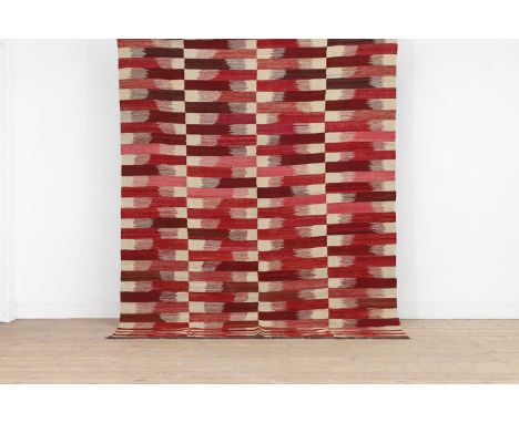 A rufarshi flat-weave wool carpet, of recent manufacture, woven in red and pink blocks on a white ground,240 x 178cm