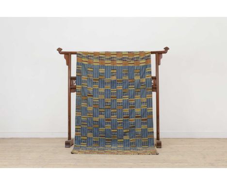 An Ewe kente cloth,mid-20th century, Ghanaian, woven with red and yellow silk in stripes and float motifs on a dark blue cott