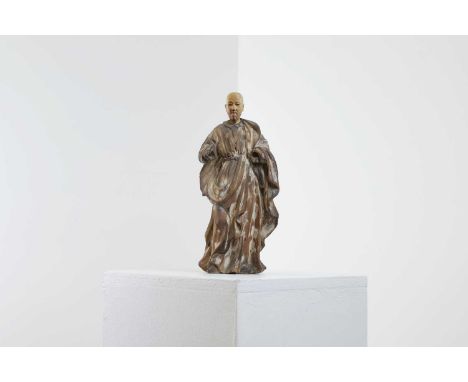 An ivory-mounted and carved wood figure,18th century, probably Spanish, depicting a saint in flowing robes, with painted deco