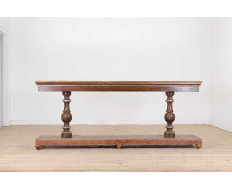 A painted pine console or serving table,19th century, Spanish, the slender rectangular top raised on a pair of baluster suppo