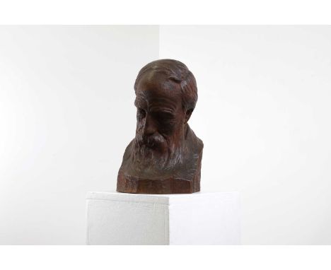 Thomas William Wilkinson (1875-1950),a carved wood bust of a philosopher, signed and dated '1914',22cm wide 37cm high