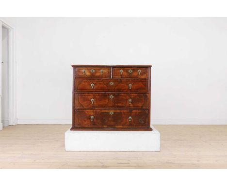 A William and Mary walnut chest, late 17th century, with line inlaid decoration and book matched veneers, fitted with two sho