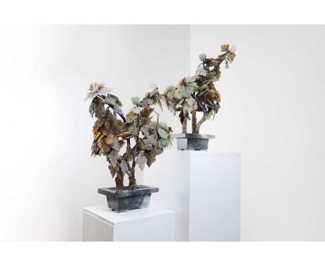 A pair of jade trees,20th century, Chinese, each in an agate planter base,29cm wide30cm deep47cm high (2)