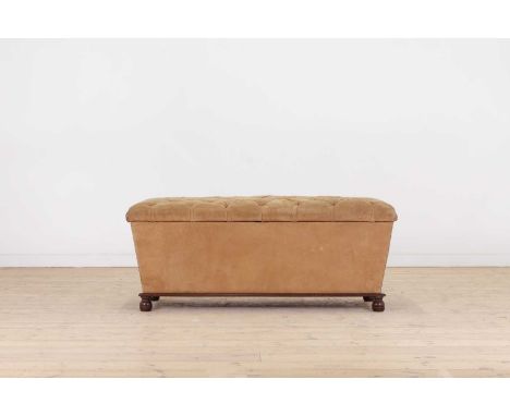 A suede leather ottoman,late 19th/early 20th century, of rectangular form with a deep button-upholstered seat, over a brass-s