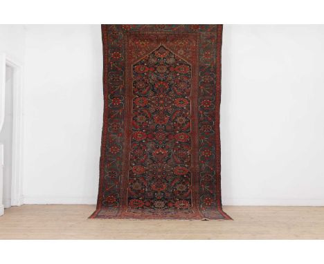 A Persian Hamadan wool runner,early 20th century, woven with repeating Shah Abbasi motifs to a blue ground, 350 x 154cmProven