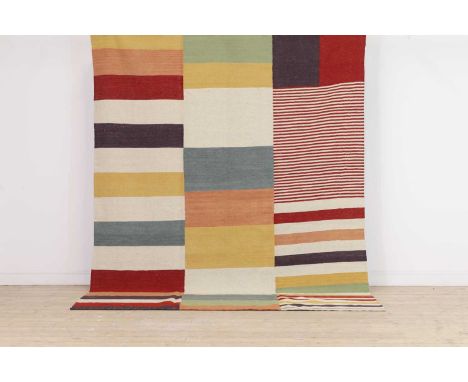 A modernist flat-weave wool carpet,of recent manufacture, with polychrome geometric decoration, 286 x 208cm