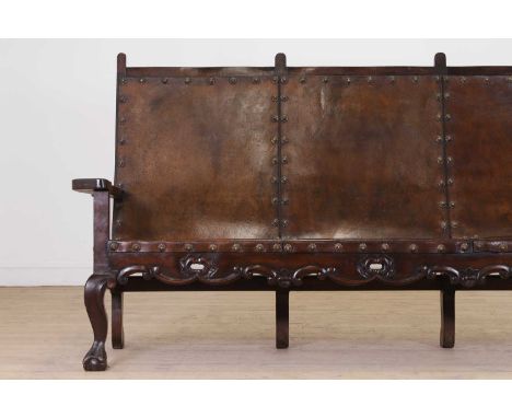 A walnut and leather bench,  early 20th century, Spanish, the back and seat with studded detail, raised on cabriole front sup