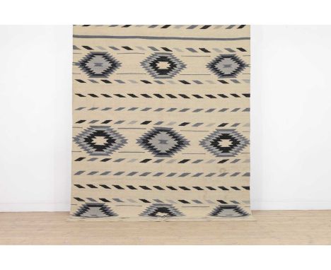 A Navajo-inspired flat-weave wool carpet,of recent manufacture,240 x 180cm