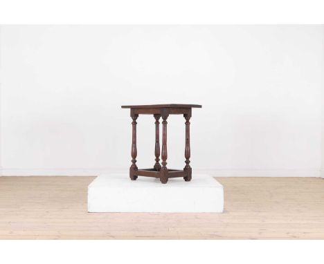 A William and Mary yew side table,late 17th century, the rectangular top raised on ring-turned supports united by stretchers,