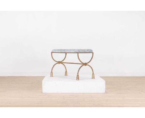 An upholstered brass stool,the buttoned silk seat over gilt rope-twist trestle ends in the form of two tied semicircles unite