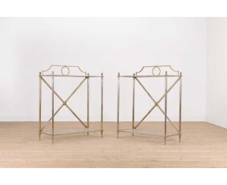 A pair of modernist metal and glass console tables, of recent manufacture, each with a rectangular glass inset top, over four