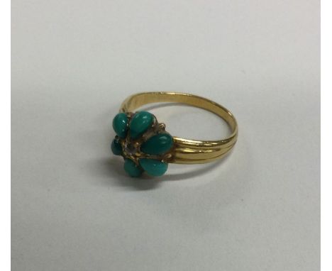 An 18 carat gold turquoise and rose diamond cluster ring. Approx. 3 grams. Est. £100 - £150.