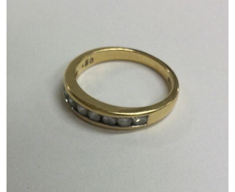 A good diamond half eternity ring in 18 carat gold mount. Approx. 3 grams. Est. £40 - £60.