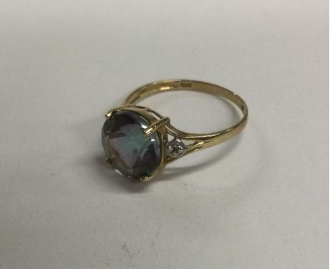 A 9 carat single stone ring in claw mount. Approx. 5 grams. Est. £20 - £30.