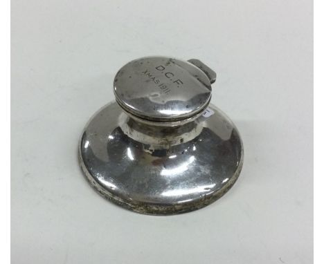 A circular silver capstan shaped inkwell. Birmingham. Approx. 90 grams. Est. £20 - £30.