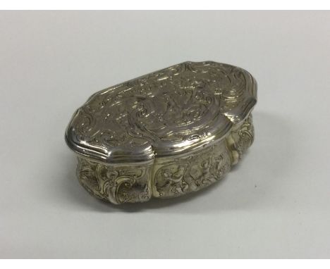 A good Continental silver gilt shaped snuff box profusely decorated with figures. Approx. 92 grams. Est. £250 - £300.