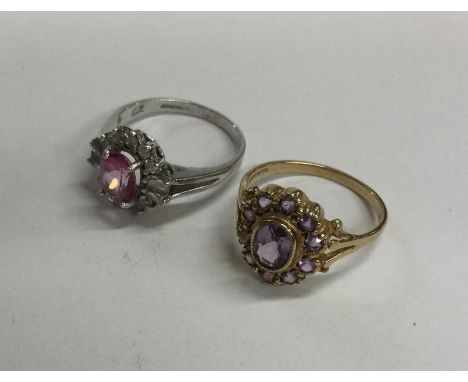 An amethyst cluster ring in 9 carat (approx. 2 grams), together with a silver ring. Est. £30 - £50.