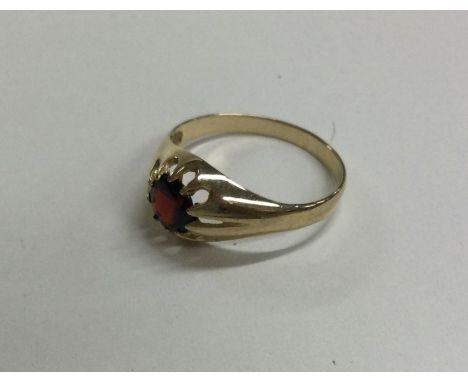 A 9 carat garnet single stone ring. Approx. 3 grams. Est. £30 - £50.