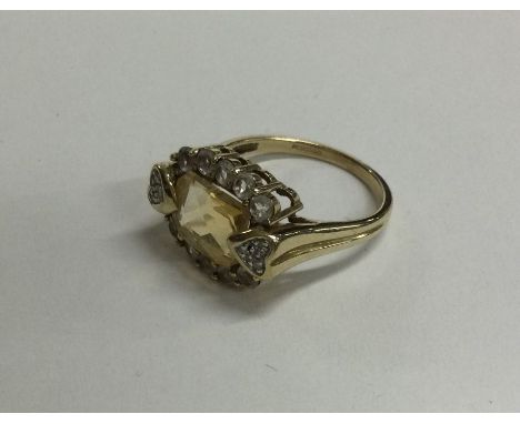 A 9 carat yellow stone ring in claw mount. Approx. 4 grams. Est. £50 - £80.