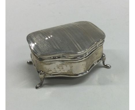 An engine turned silver mounted ring box. Birmingham. By WW. Approx. 40 grams. Est. £50 - £80.