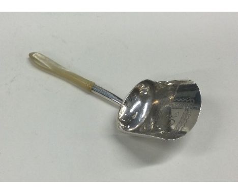 A George III bright cut silver and MOP caddy scoop. Birmingham 1804. By IT. Approx. 9 grams. Est. £80 - £120.