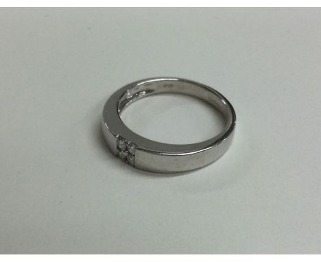 A good plain 18 carat white gold ring set with diamonds. Approx. 3 grams. Est. £80 - £120.