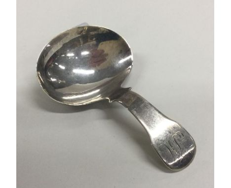 A George III fiddle pattern silver caddy spoon. London 1810. Approx. 8 grams. Est. £25 - £30.