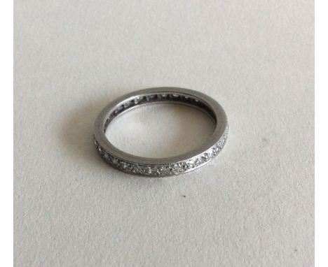 A diamond full eternity ring in platinum setting. Approx. 4 grams. Est. £200 - £300.