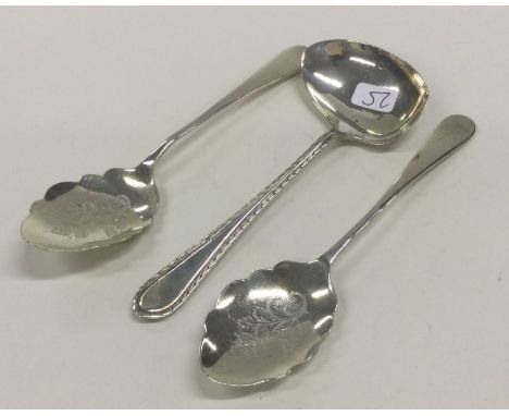 A pair of silver mounted preserve spoons together with a silver ladle. Sheffield. Approx. 58 grams. Est. £20 - £30.