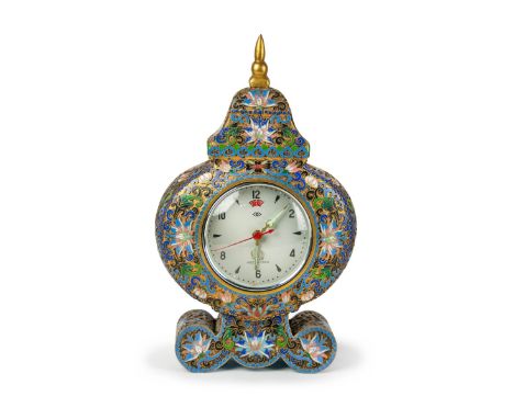 A lovely french ormolu and champleve enamel mantel  clock of rococo form, decorated with scrolling  foliage. H:10in(25.4cm) W