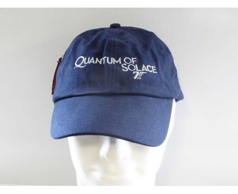 Film / Production Crew Issued Clothing: JAMES BOND: QUANTUM OF SOLACE - A blue 'XL' short sleeve t-shirt and cap - PROVENANCE