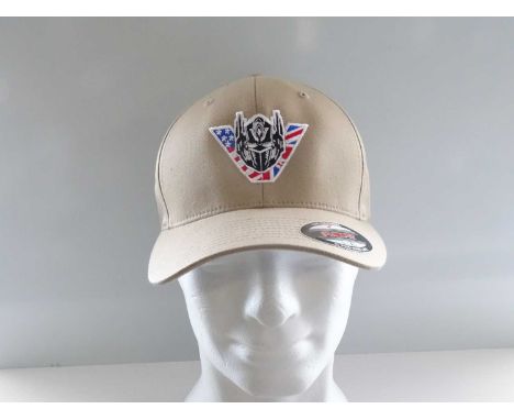 Film / Production Crew Issued Clothing: TRANSFORMERS: THE LAST KNIGHT - A stunt team 'L' black t-shirt together a beige cap -