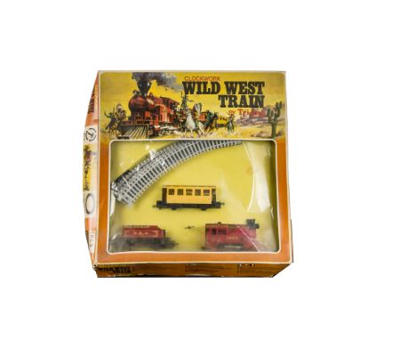 Tri-ang Wild West 00 Gauge Clockwork Train Set, comprising red 1963 0-4-0 Engine, tender, 4-wheel coach and eight pieces of g