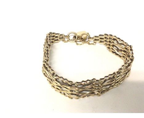 A 9ct gold gate bracelet. 24.3gPostage B