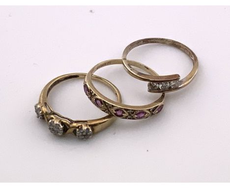 A 9ct gold 3 stone diamond ring (Size P), 9ct Ruby and diamond ring (Size R), 9ct gold and diamond illusion ring (P).