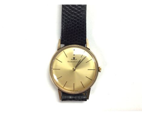 A Jaeger LeCoultre men's vintage gold dress watch. Comes with box and service paperwork. Winds and runs. 36mm case. Gold colo