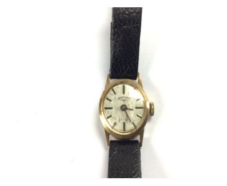 A vintage ladies 9ct gold rotary watch with leather strap. Winds and runs. 8.2g