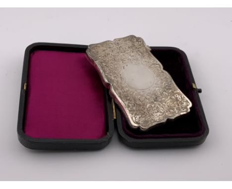 A leather cased hallmarked silver card case, engine turned decoration. Colen Hewer Cheshire, Birmingham 1893.