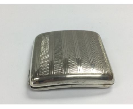 A silver cigarette case with engine turned banded decoration, Birmingham hallmarks. Shipping category A.