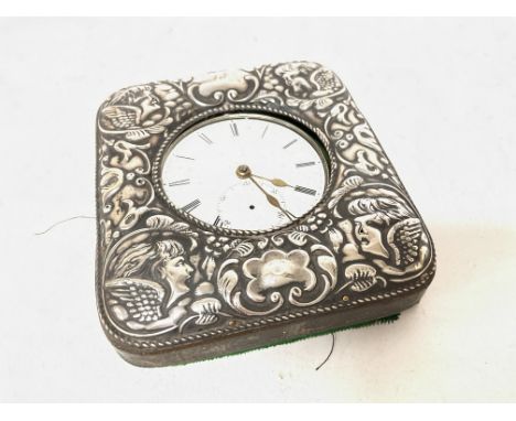 A Silver pocket watch and a silver clock holder